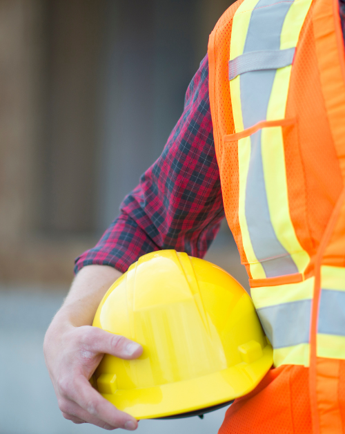 Image of a workman wearing high viz and safety helmet