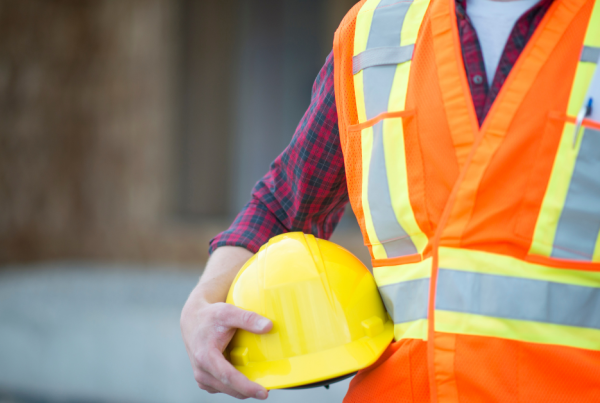 Image of a workman wearing high viz and safety helmet